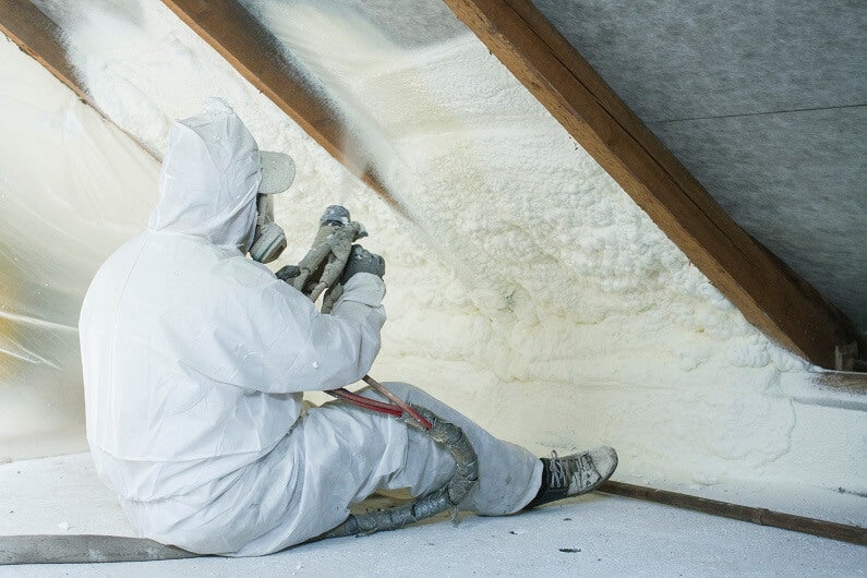 Spray foam installer at work in the Fargo-Moorhead area